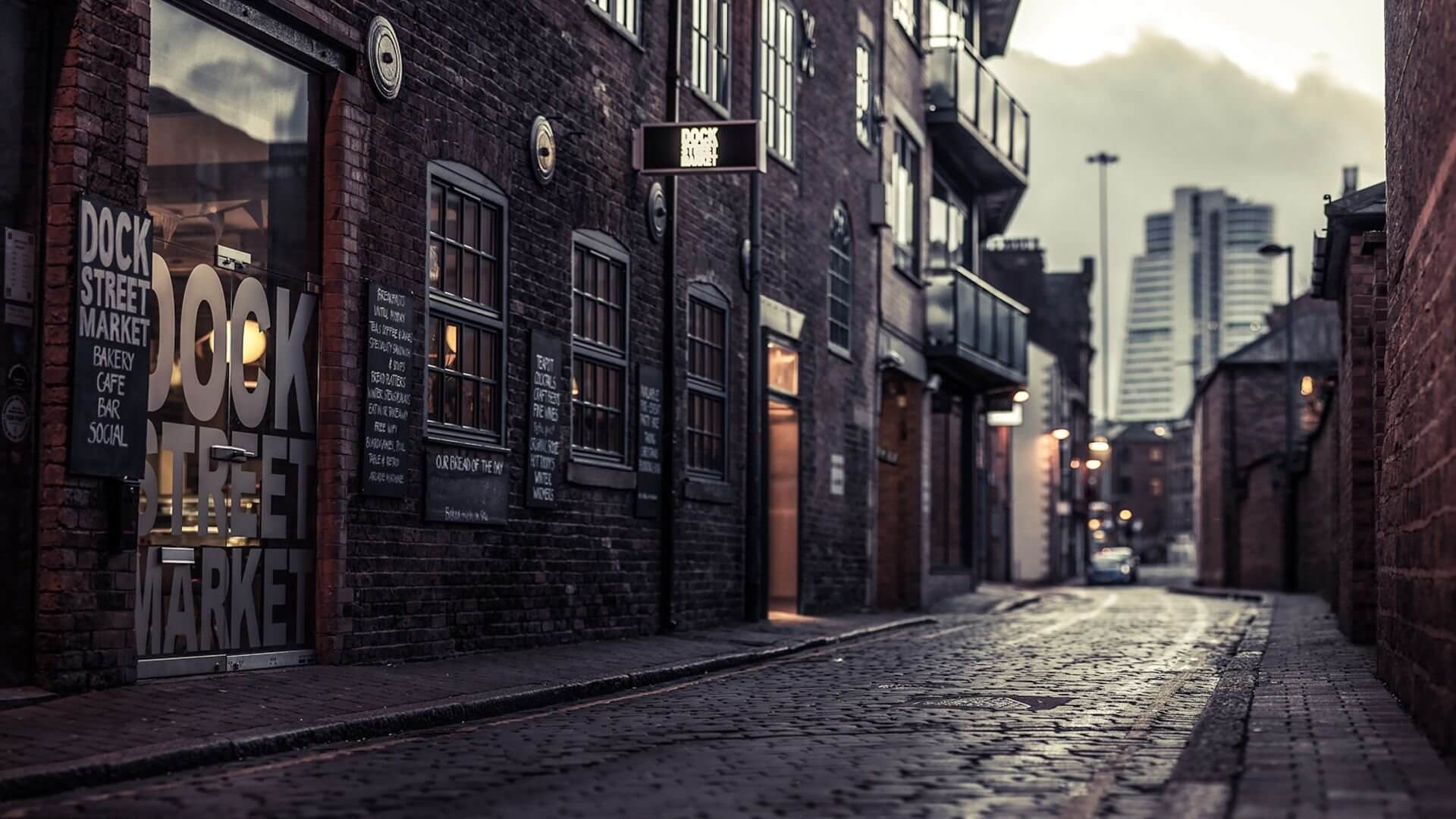 Photo of a narrow street in an urban area for an urban studies paper